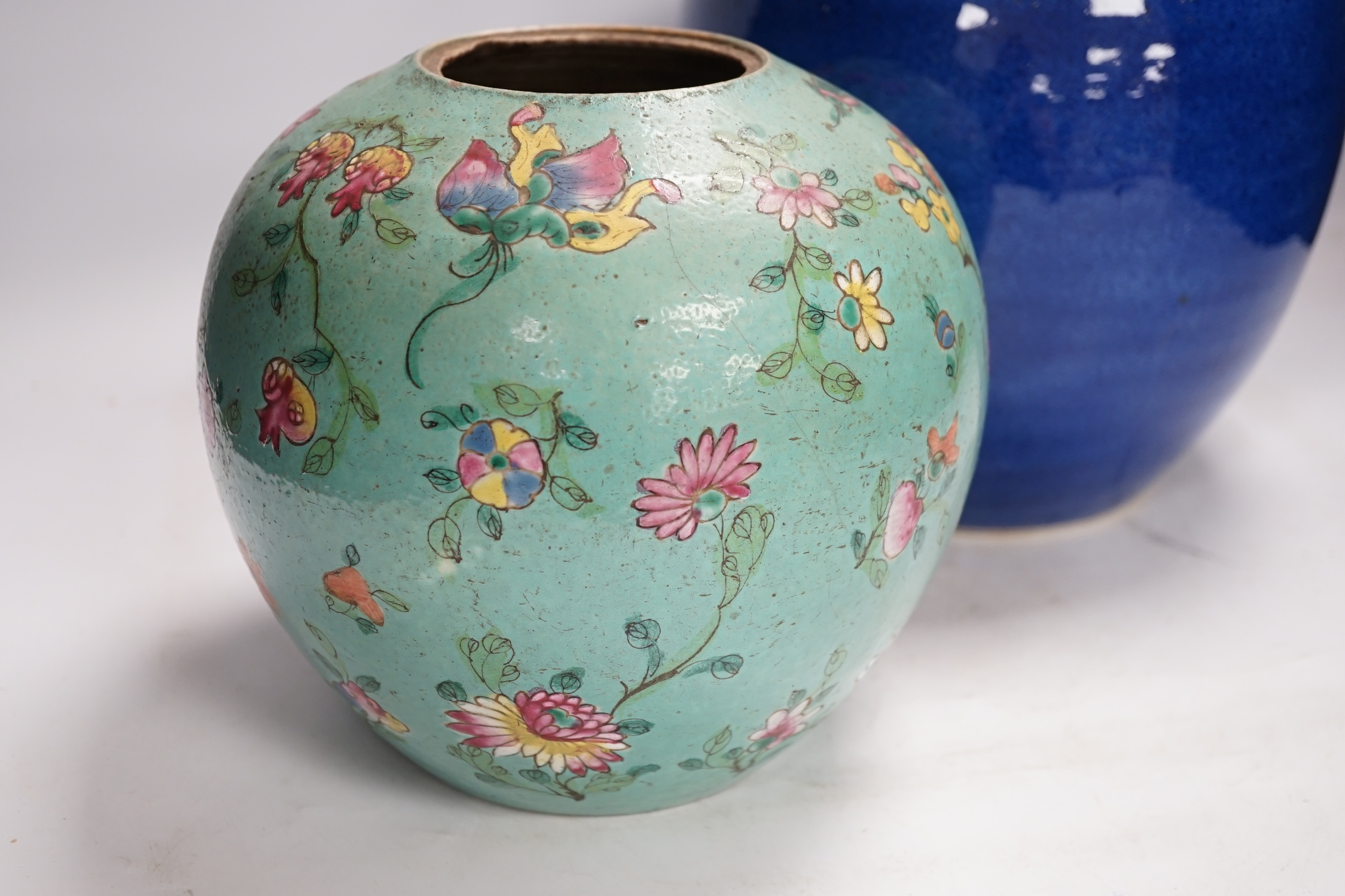 A Chinese powder blue jar, late 19th century, drilled hole to base and a turquoise glazed ground jar, blue vase 22cm high. Condition - turquoise jar cracked and chipped
